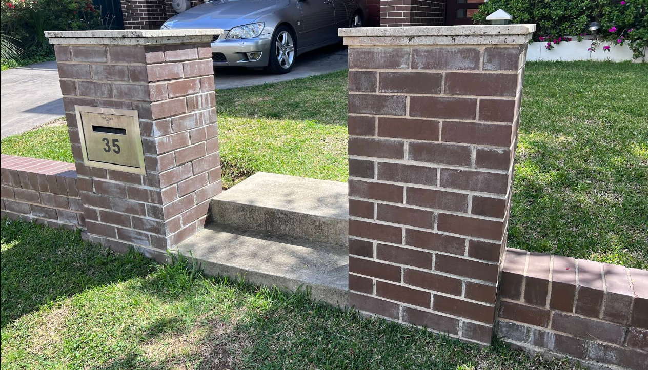 Restored brick front fence and piers with a clean, even finish
